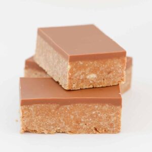 A no-bake caramel slice made with crushed biscuits, condensed milk and caramel chocolate.