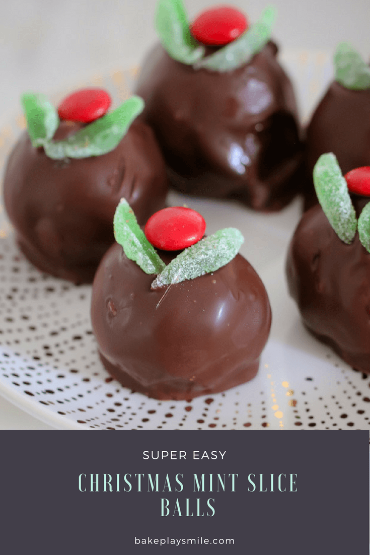 Christmas Mint Slice Balls coated in chocolate and decorated with mint leaves and red M&Ms. 