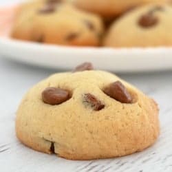 A close up of a cookie baked with chocolate chips inside
