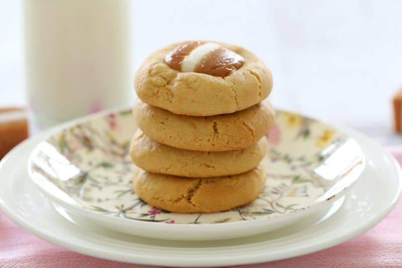 A stack of four Jersey Caramel cookies on a plate