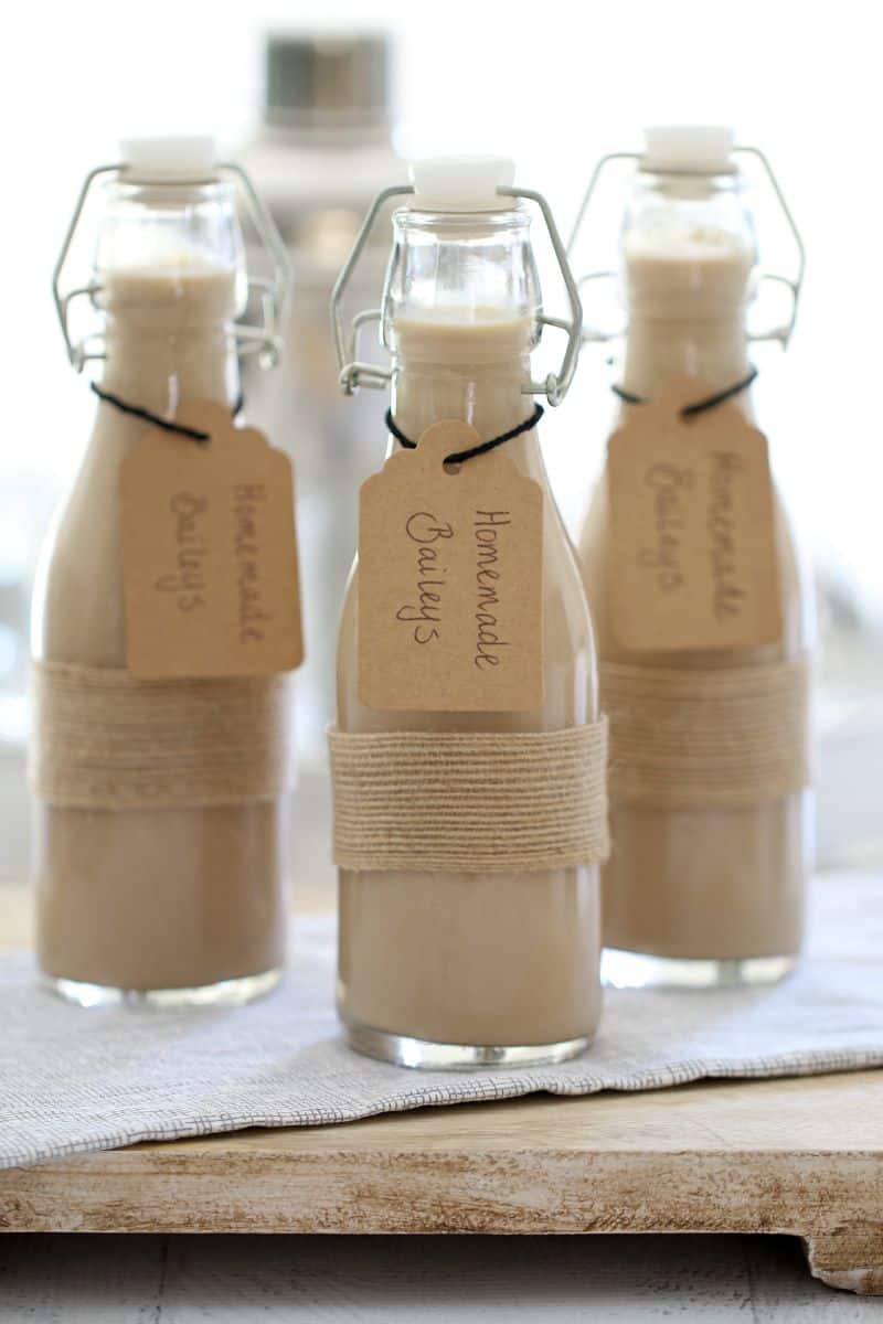 3 pretty bottles with homemade baileys in them.