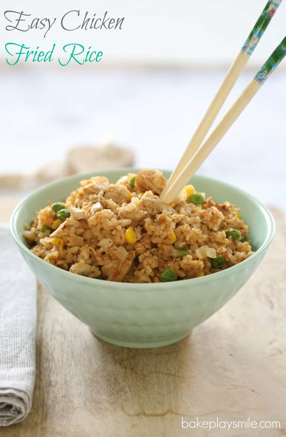 Fried rice and chopsticks in a pale blue bowl