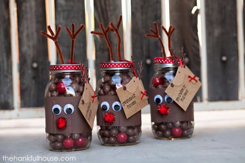 Jars filled with chocolate balls, and decorated with antlers and faces to look like reindeer, with a label saying Reindeer Noses