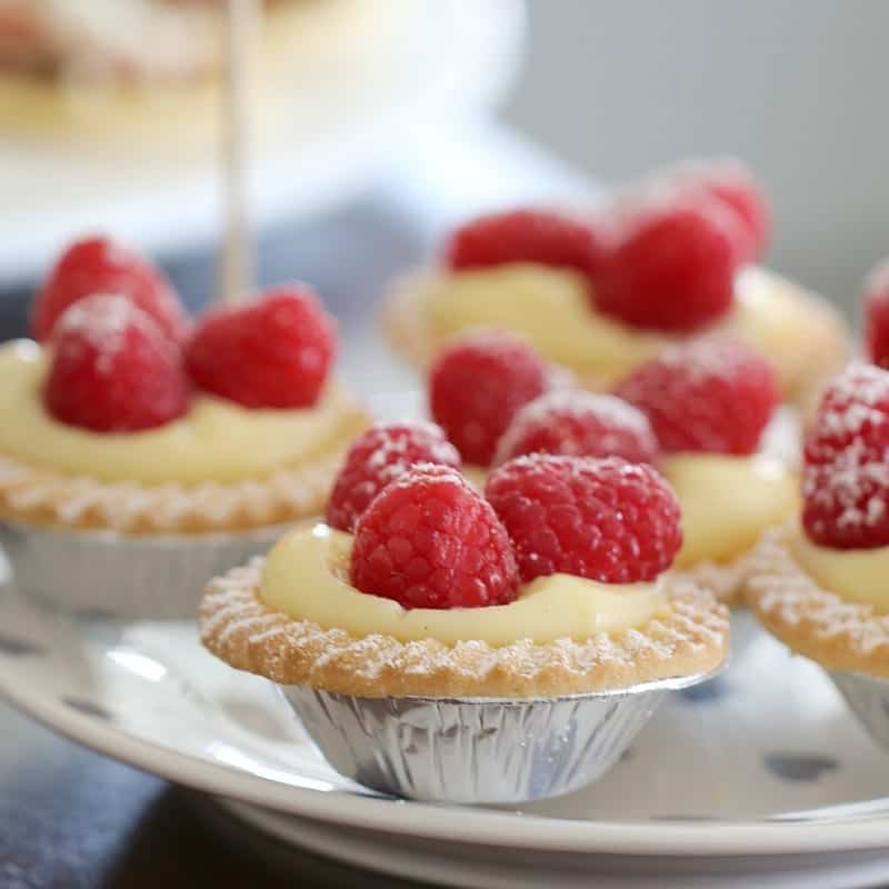 Vanilla Custard Tarts with Fresh Raspberries - Bake Play Smile