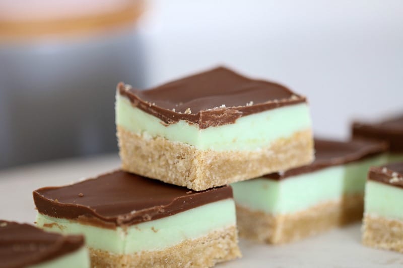 Peppermint slice pieces with a pale green minty layer over the base, and a chocolate layer on top