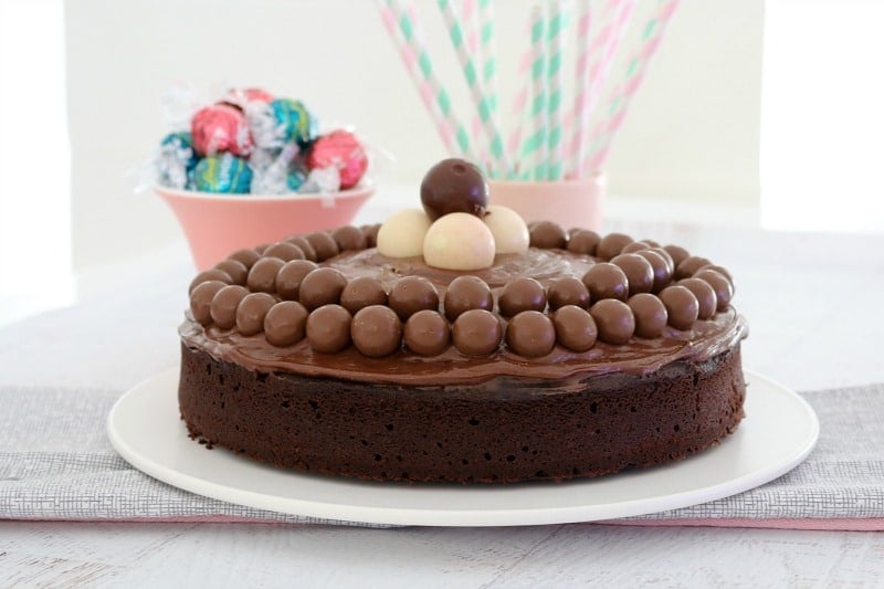 A chocolate cake decorated with chocolate ganache, Maltesers and Lindt balls