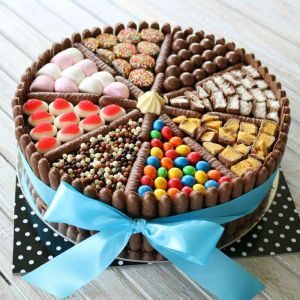 A chocolate Birthday cake decorated with sweets and chocolate confectionery