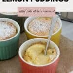 Individual ramekins filled with lemon pudding and dusted with icing sugar.