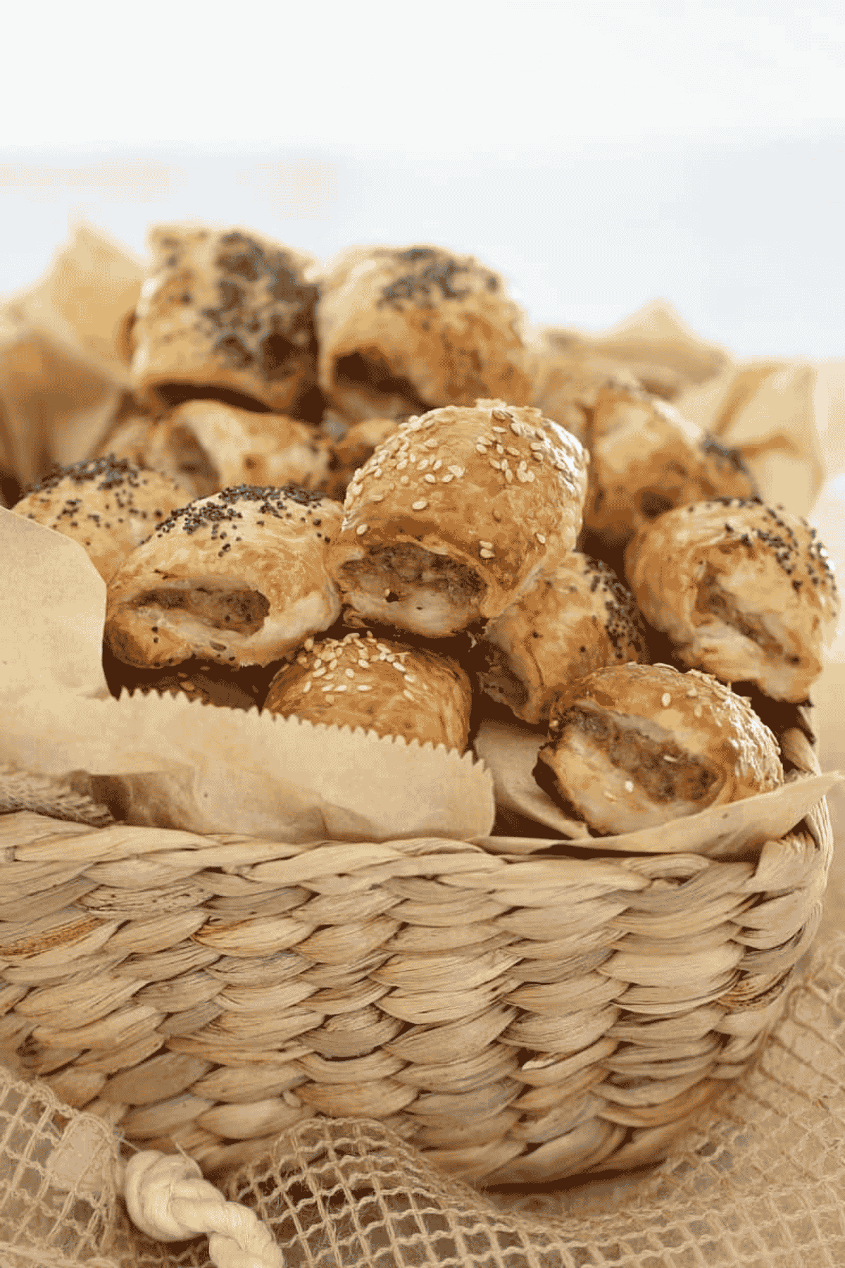 Lamb sausage rolls in a basket.