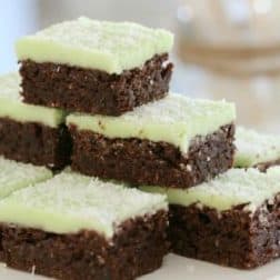 Stacked pieces of a chocolate slice with a mint icing on top