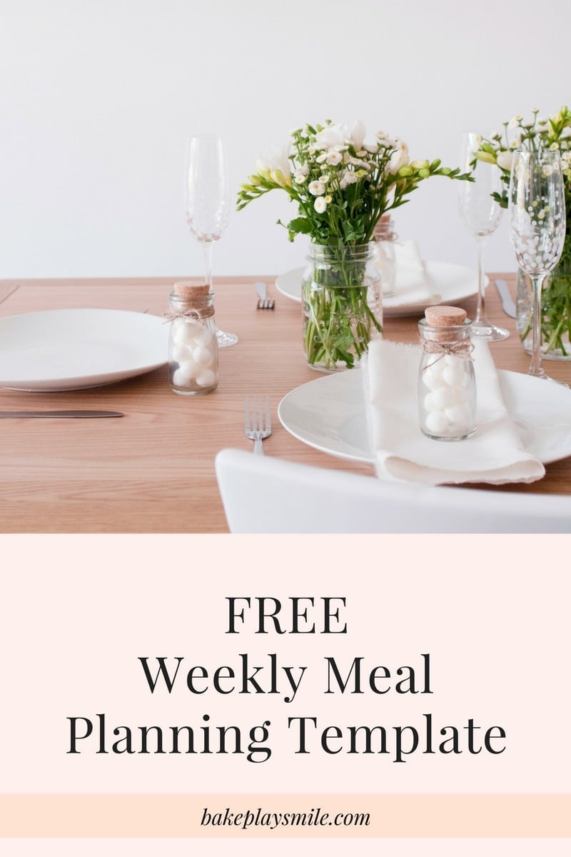 A table setting with white plates and cutlery and small vase of flowers with text saying Free Weekly Meal Planning Template