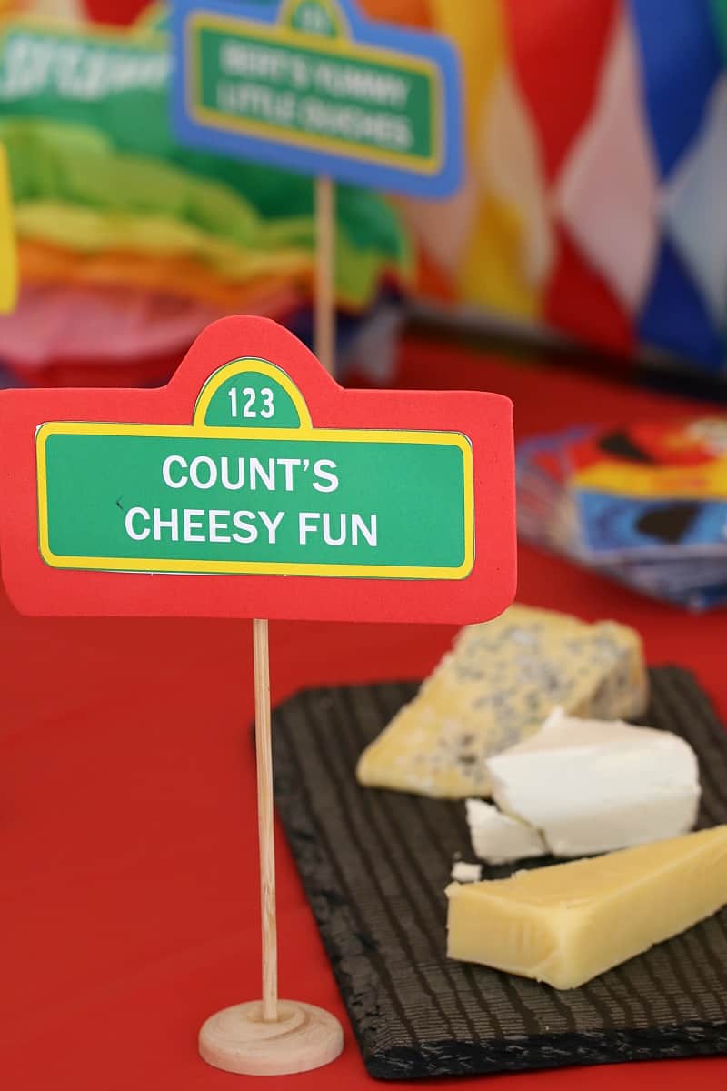 A sign saying Count\'s Cheesy Fun in front of a cheese platter