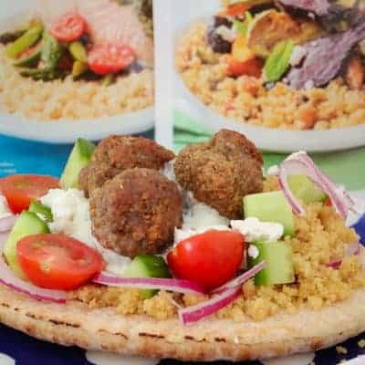 These super yummy oven baked Greek Lamb Meatball Pitas are the perfect family dinner! Top with couscous, cucumber, tomatoes, feta, red onion and tzatziki for a meal everyone will love.