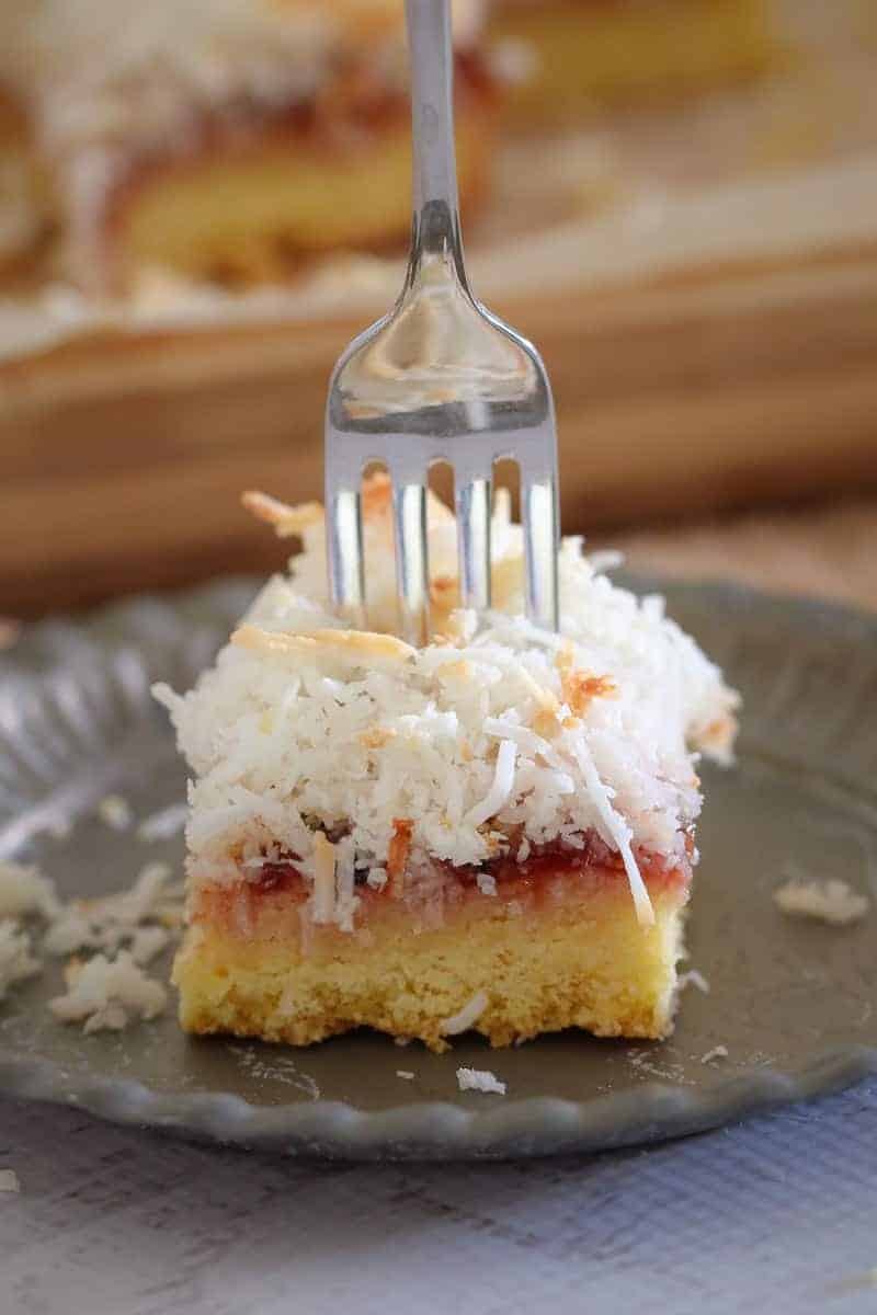 A delicious twist on a classic favourite... this 4 layered Coconut, Passionfruit & Raspberry Jam Slice is even better than the original!