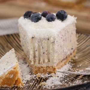 A delicious no-bake White Chocolate & Blueberry Cheesecake decorated with fresh blueberries and grated chocolate. This is the perfect summer dessert!