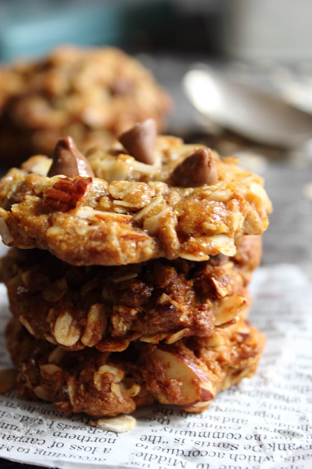 A close up of a stack of biscuits loaded with almonds and chocolate chips