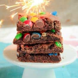 This one-bowl M&M Chocolate Brownie Slice is the perfect mix of chewy and crunchy! A delicious chocolate brownie filled with bright and colourful M&Ms.
