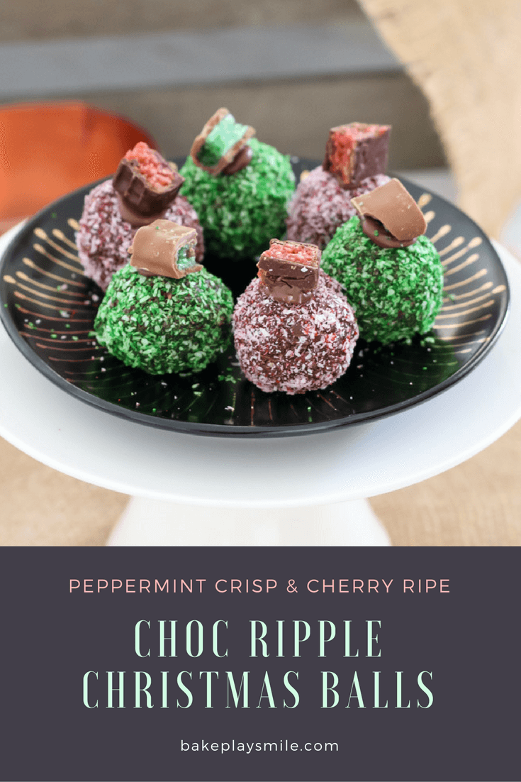 Red and green Christmas balls covered in coconut and topped with chocolate bars. 