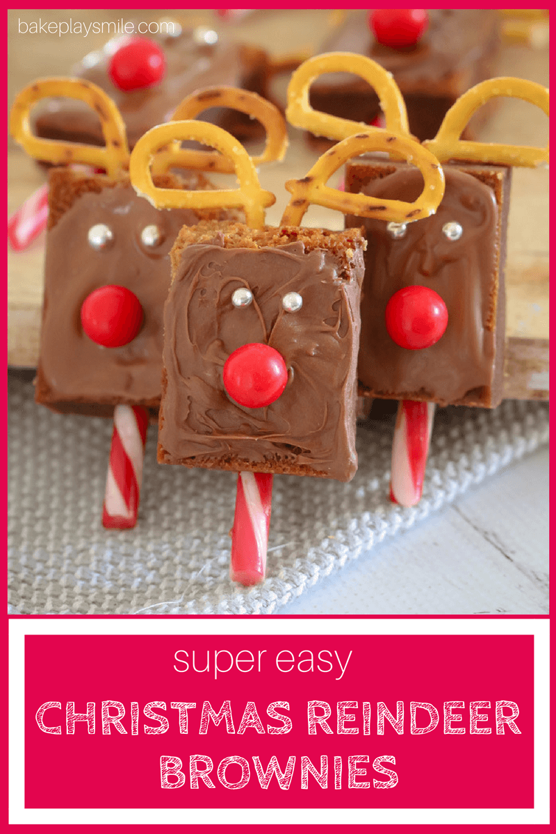 Brownies decorated to look like Christmas reindeers with candy canes, pretzels and jaffas.