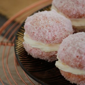 A classic fave... these Raspberry & Cream Jelly Cakes are always a hit! Bites of buttery vanilla cake filled with whipped cream and coated in raspberry jelly and coconut.