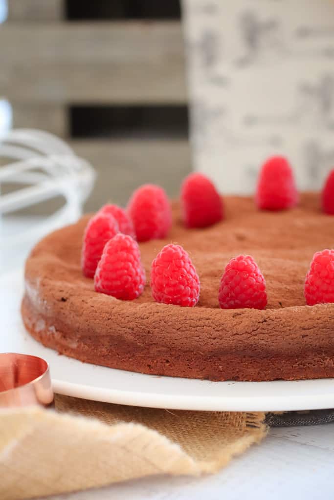 Fresh raspberries decorating the top of the rich chocolate torte