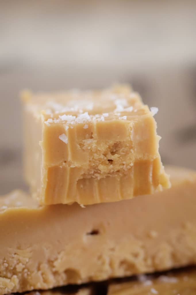 A piece of caramel fudge with a bite mark taken out. 