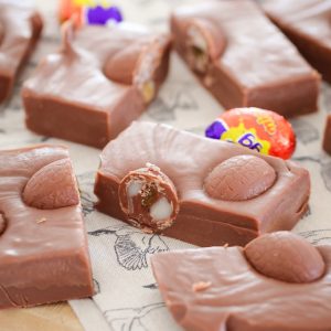 A super easy 5 minute microwave Cadbury Creme Egg Fudge made from just 3 ingredients... condensed milk, chocolate and Cadbury Creme easter eggs!