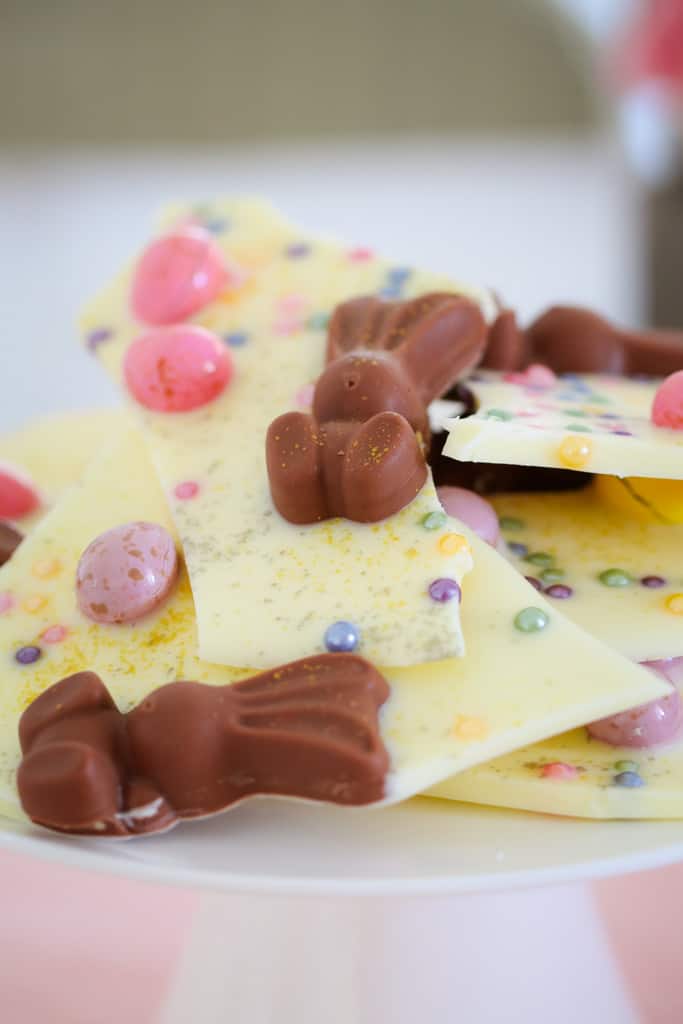 Pieces of white chocolate Easter bark made with mini Malteser bunnies, speckled eggs and sprinkles. 