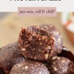 A pile of protein balls with a bite taken out of one.