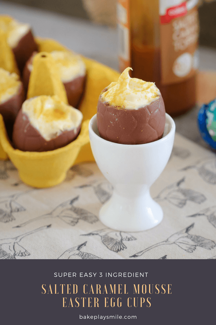 A half eaten chocolate hollow easter egg filled with caramel mousse and extra filled eggs in the background. 