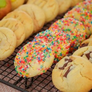 Introducing the famous 100 Cookie Recipe made with just 4 ingredients... butter, caster sugar, condensed milk and self-raising flour. This freezer-friendly cookie dough can be flavoured with any add-ins you like!