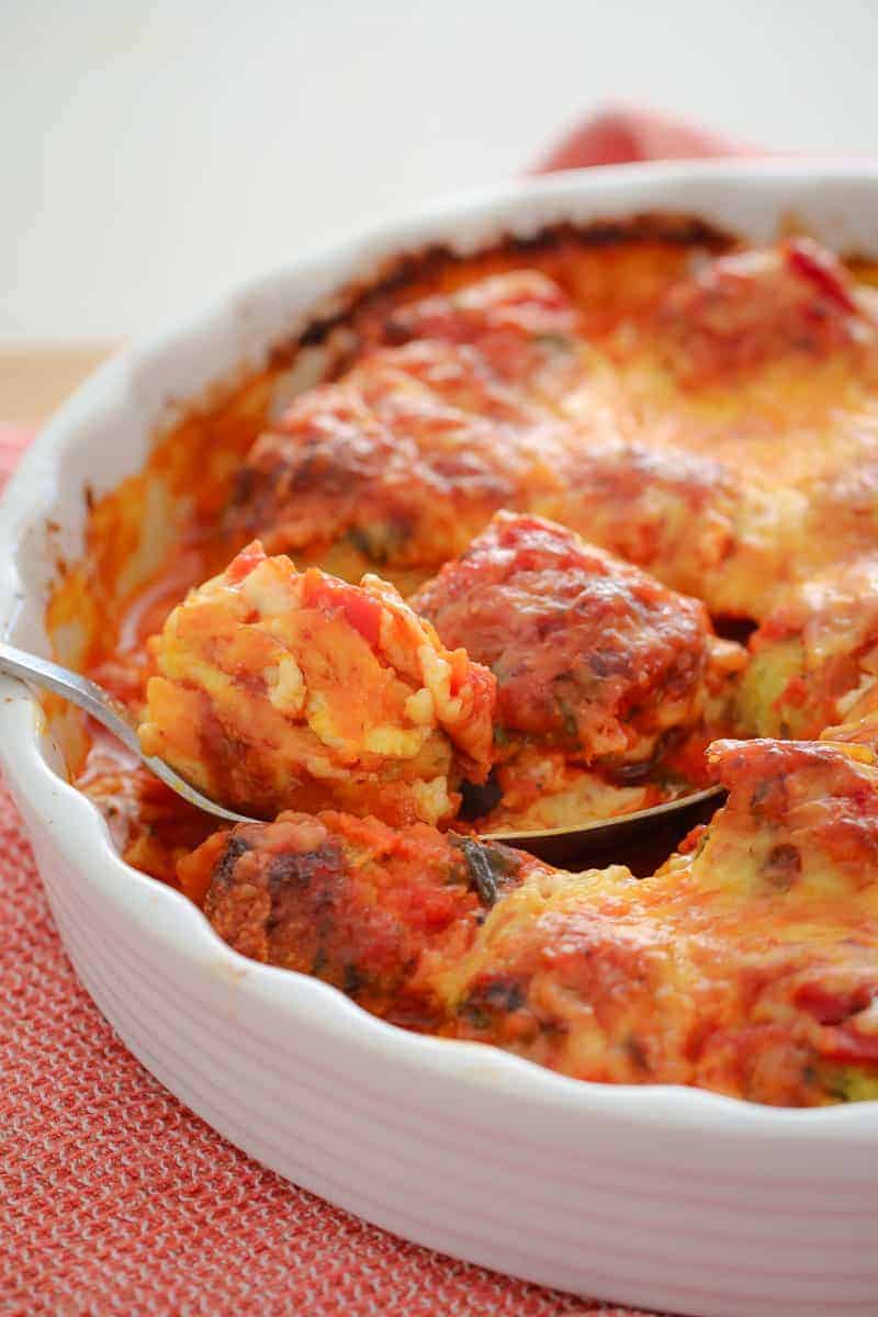 A scoop of oven baked chicken, tomato and cheese meatballs. 