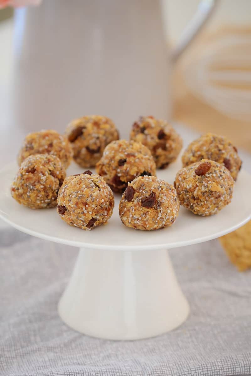 A white cake stand with nine Weet Bix Bliss Balls 