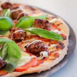 Introducing the ultimate crispy based Italian Pizza with Pork Sausage, Basil & Tomato! This delicious recipe is an absolute winner on pizza night!!