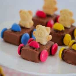 These super cute Tiny Teddy Racing Cars are the ultimate in kids party food! Made from Milky Ways, Smarties and Tiny Teddies, these quick and easy cars are always a hit!