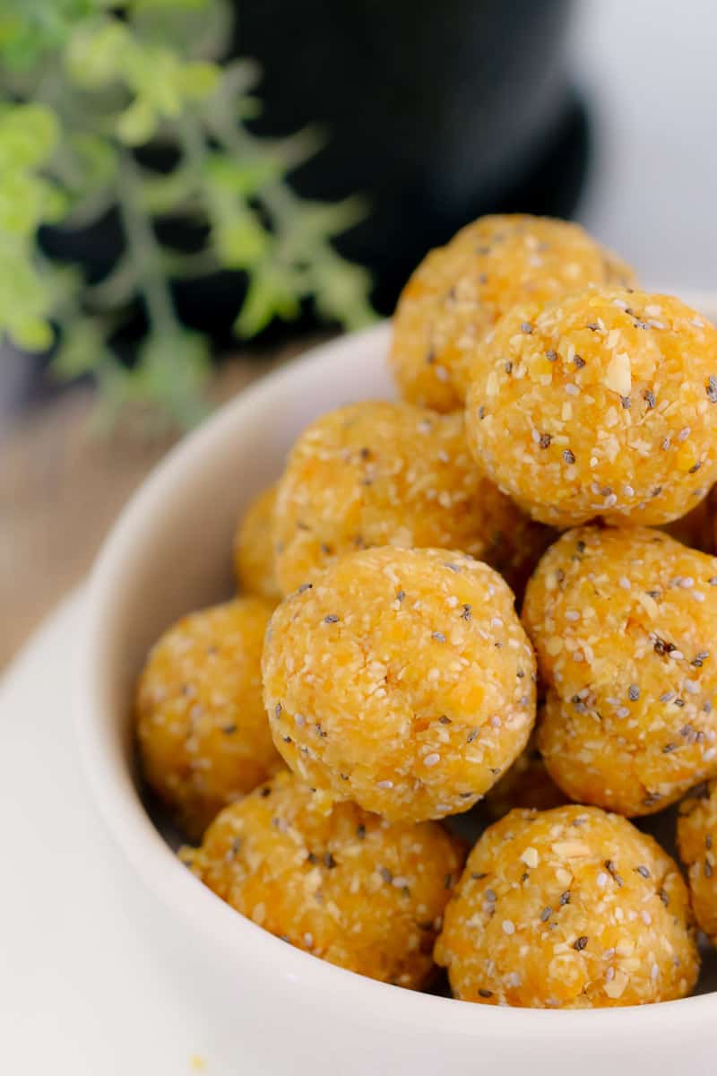 A white bowl filled with Apricot, Coconut & Chia Bliss Balls