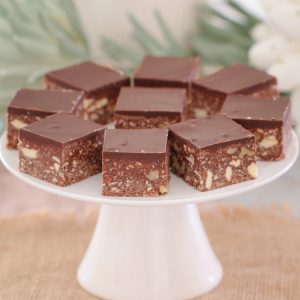 A quick and easy classic dark chocolate hedgehog slice made with crushed biscuits, walnuts, coconut and condensed milk... the perfect melt and mix slice!