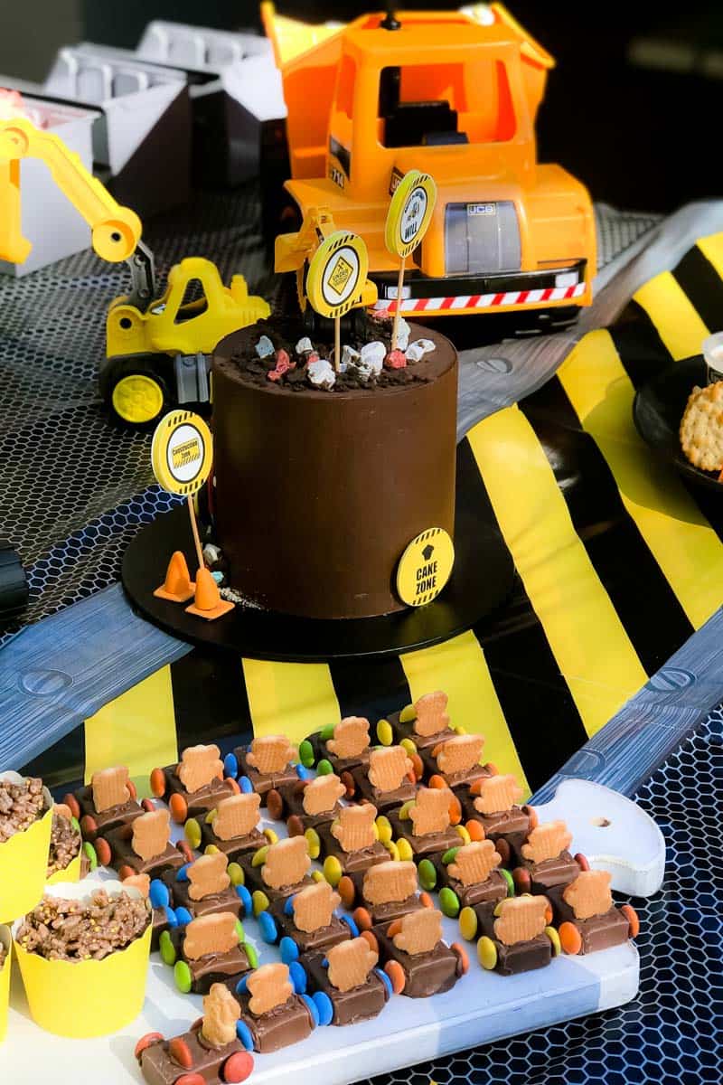 Party food with a Digger Party theme, with mini toy trucks and road signs