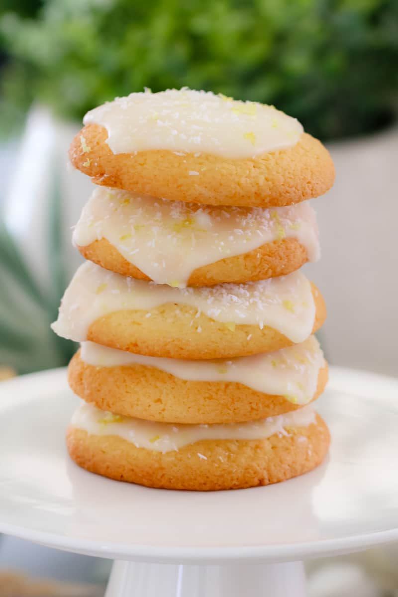 A stack of coconut biscuits with lemon icing on top.