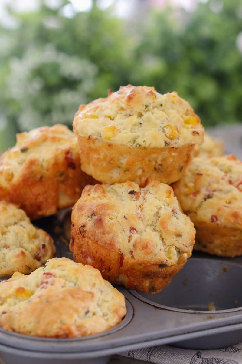 A stack of savoury muffins on a muffin baking tray