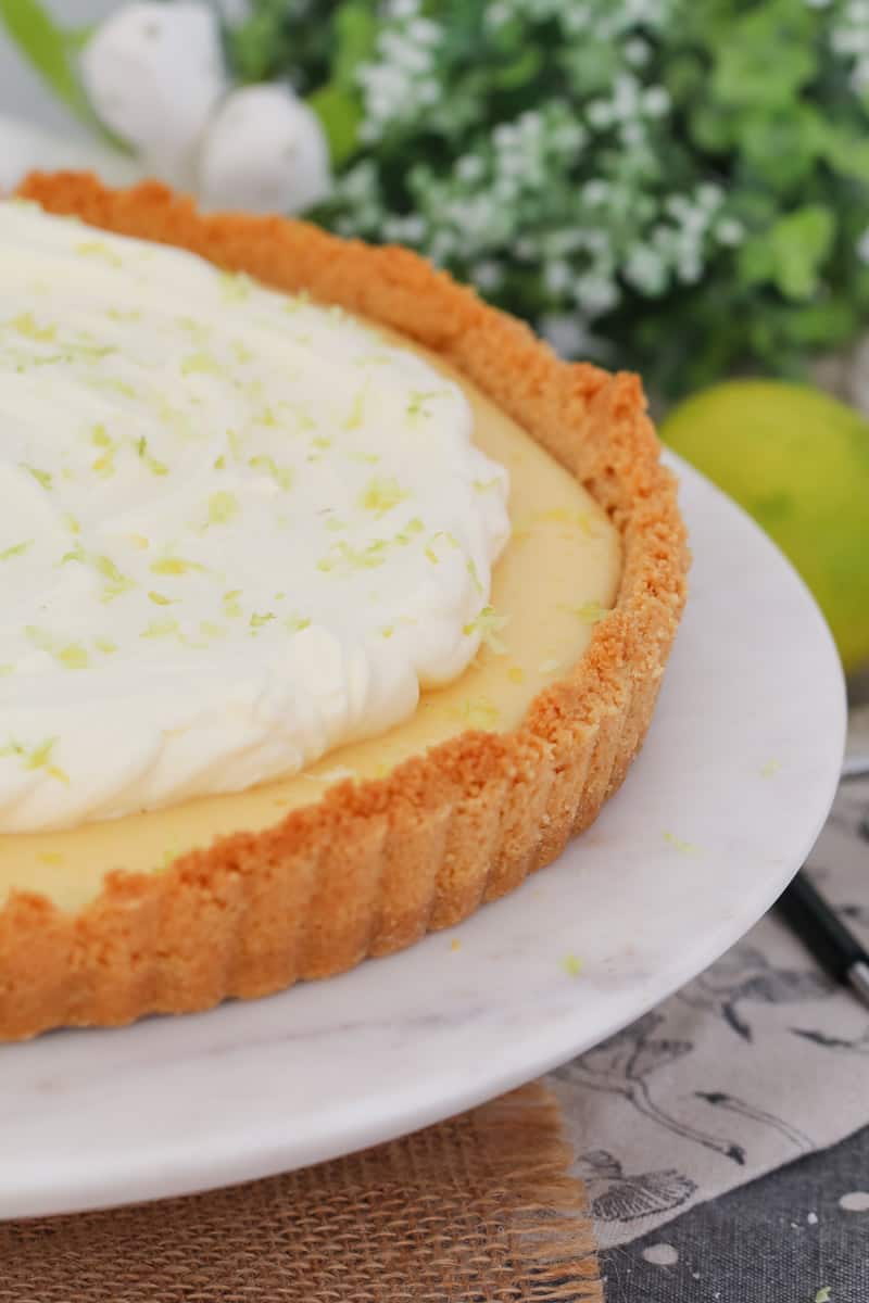 A cookie crumb pie crust filled with a creamy filling and whipped cream topping.