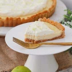 A deliciously simple Key Lime Pie made with a crushed biscuit base, a baked creamy lime filling with sweetened condensed milk and eggs, and a whipped cream topping. A quick and easy dessert the whole family will love! Printable conventional and Thermomix recipe cards included. 
