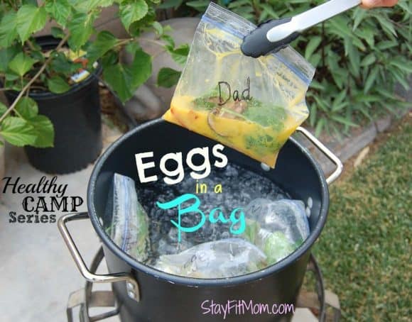 Eggs being cooked in a bag over a camp stove. 