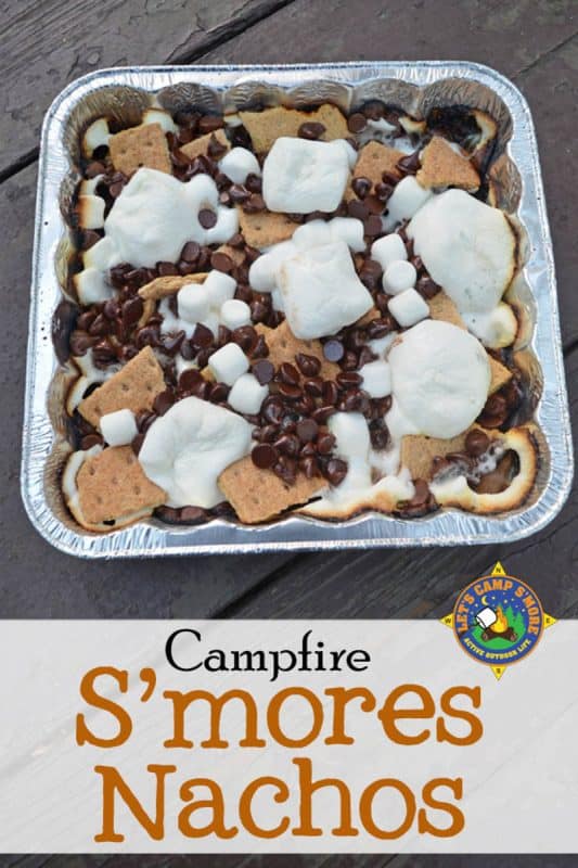 A foil tray of smores filled with marshmallows, graham cookies and chocolate chips. 