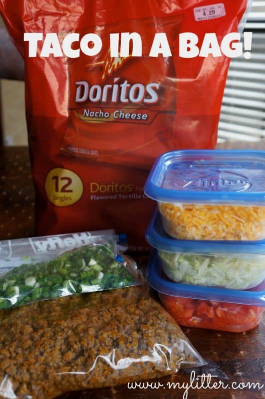 The ingredients for Tacos in a Bag - spring onion, doritos, cheese, minced meat, lettuce and tomatoes. 