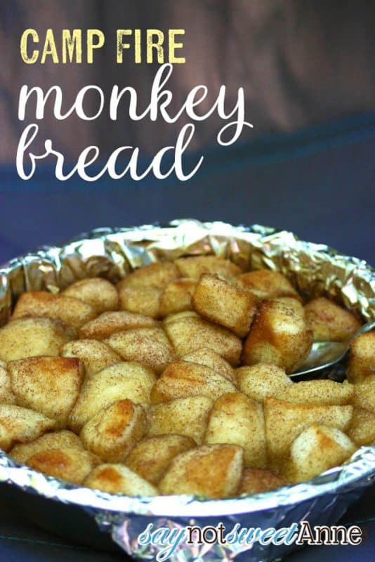 Monkey bread being cooked in a foil tray on a camping oven. 