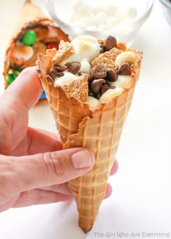 A wafer cone filled with marshmallows, chocolate chips and graham cookies. 