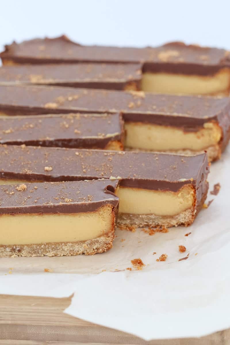 Long slices of caramel shortbread topped with chocolate and gold sugar. 