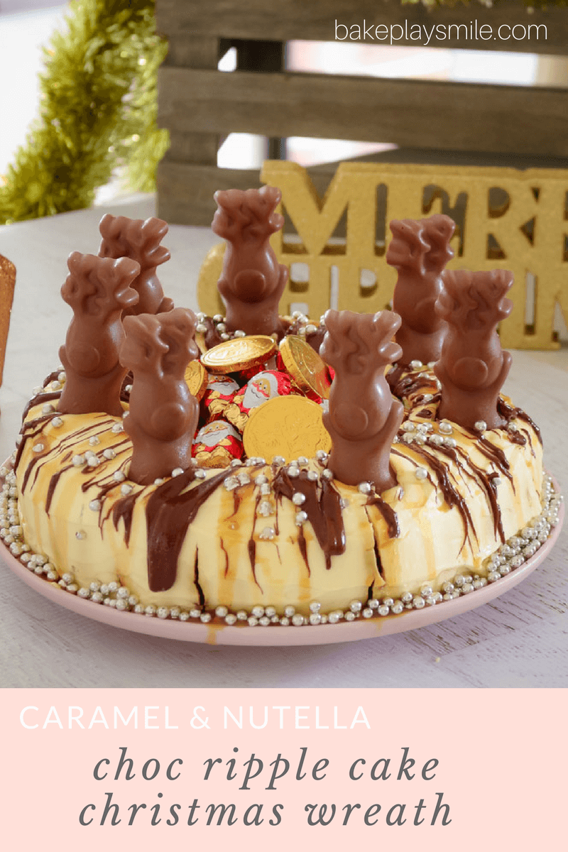 A bundt shaped cake, drizzled with chocolate and decorated with chocolate animals, silver balls and lollies