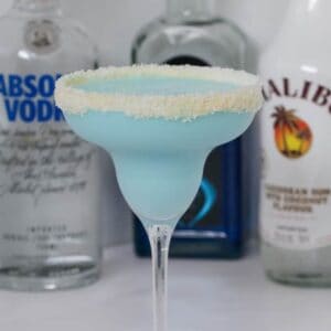 Our boozy Blue Coconut Rum Cocktail made with Malibu, Vodka, Blue Curacao, coconut water and coconut cream is deliciously refreshing!